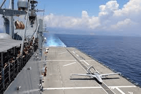 High-speed naval ship sailing in open sea, turkish military vessel, advanced warship technology.