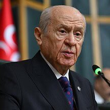 Devlet Bahçeli speaking at a political event, MHP leader discussing party reactions.